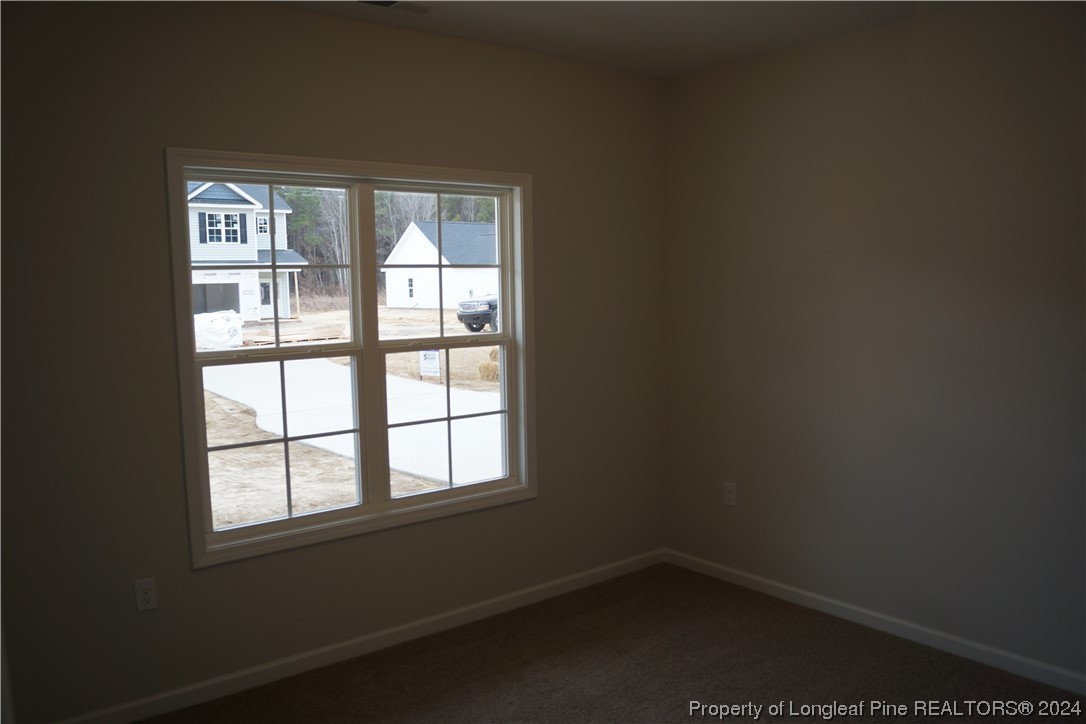111 Knotts Berry Road Bunnlevel, NC 28323 - Photo 9 of 32 an empty room with a window