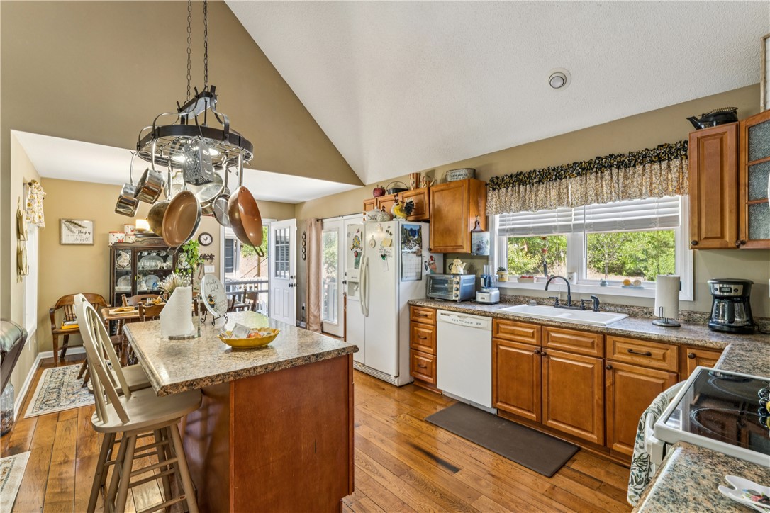 189 Little Choestoea Road Westminster, SC 29693 - Photo 9 of 38 This spacious kitchen features warm wood flooring and ample counter space, perfect for everyday living.