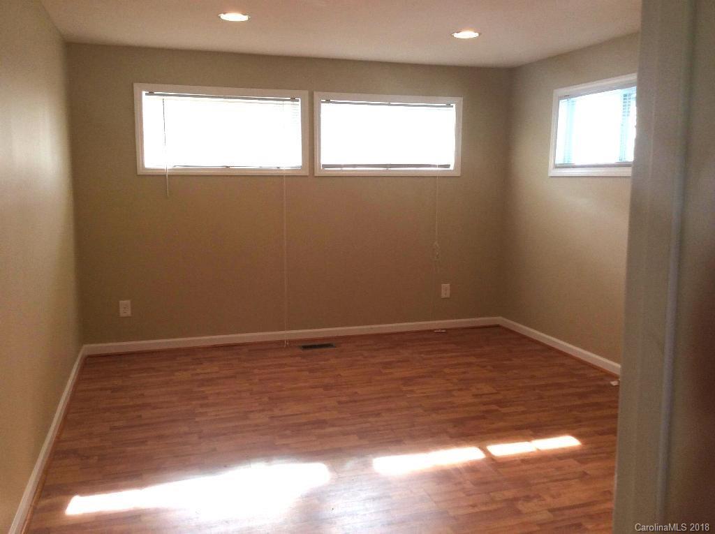 1305 Miles Road Dallas, NC 28034 - Photo 5 of 12 a view of empty room with wooden floor and fan