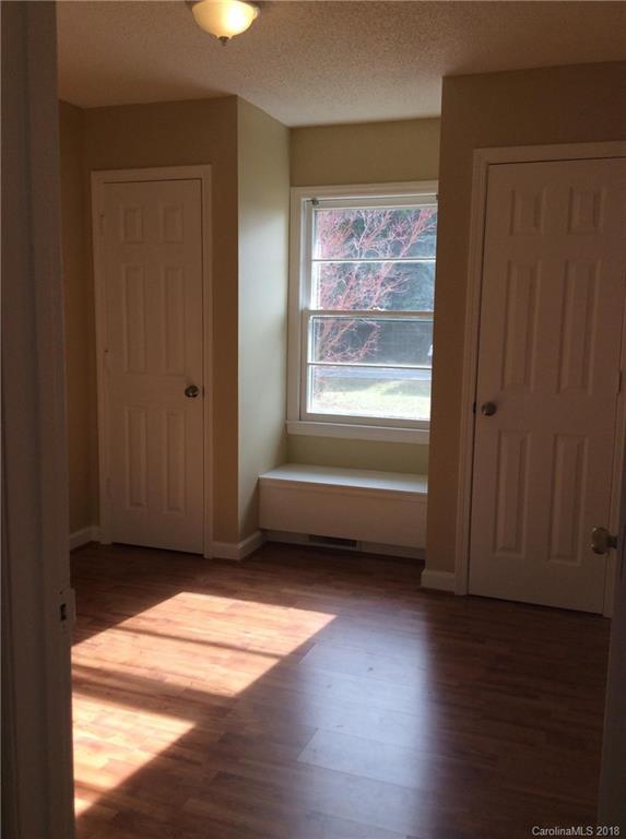 1305 Miles Road Dallas, NC 28034 - Photo 9 of 12 a view of empty room with wooden floor and fan