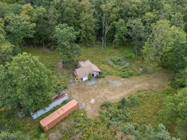 a wooden bench sitting in the middle of a forest