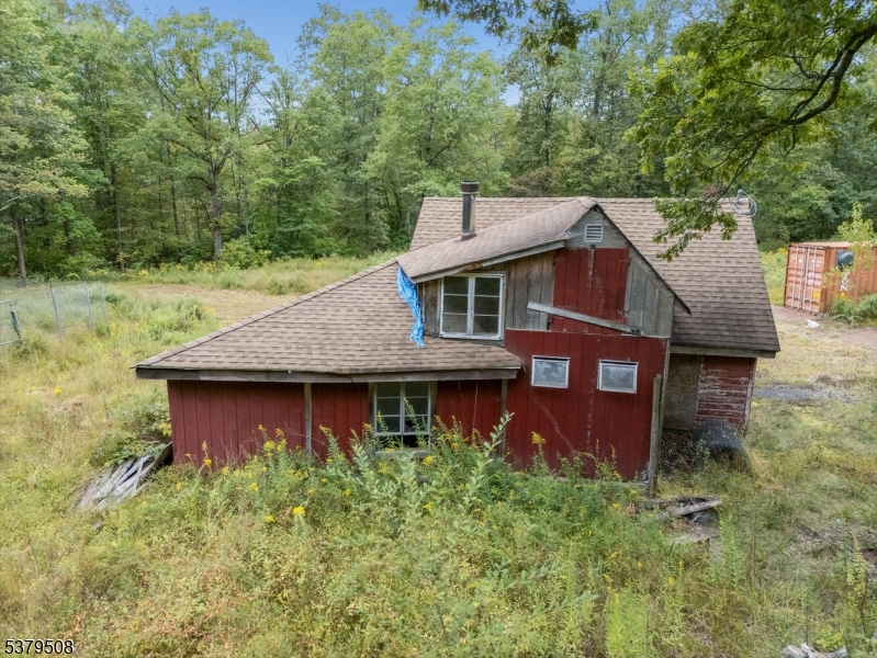 601 Fox Farm Road Asbury, NJ 08802 - Photo 9 of 15 a view of a house with a yard plants and large tree