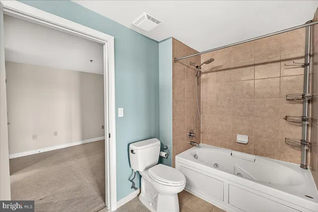 a bathroom with a bathtub toilet and sink