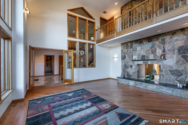 a view of an entryway with wooden floor
