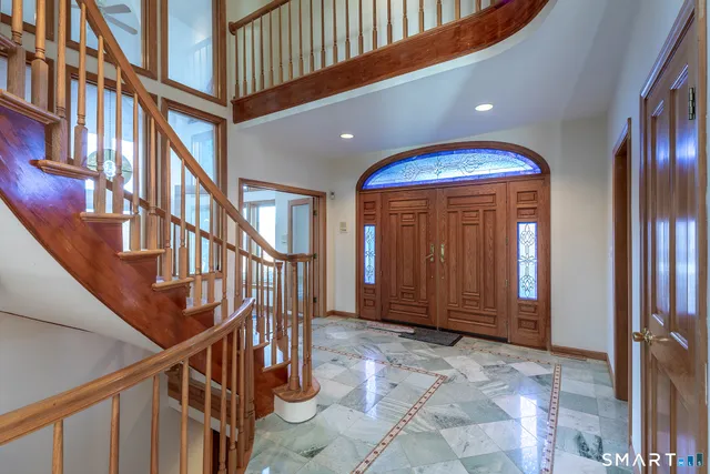 a view of entryway with a front door