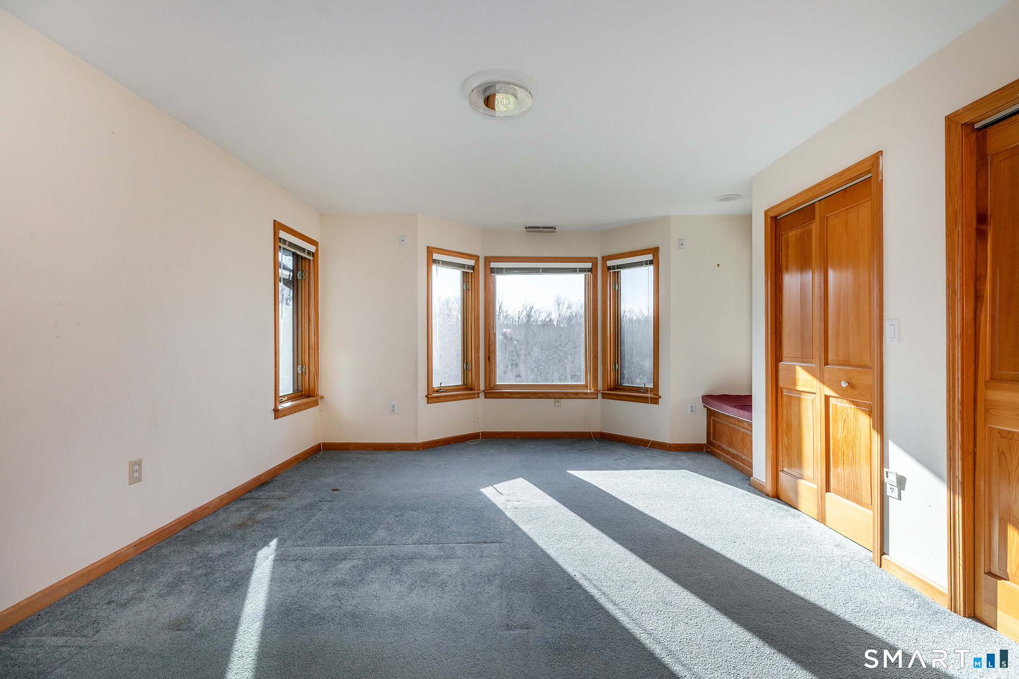 233 Southbury Road Roxbury, CT 06783 - Photo 23 of 38 a view of an empty room with large windows