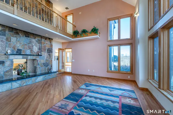 a view of an entryway with wooden floor