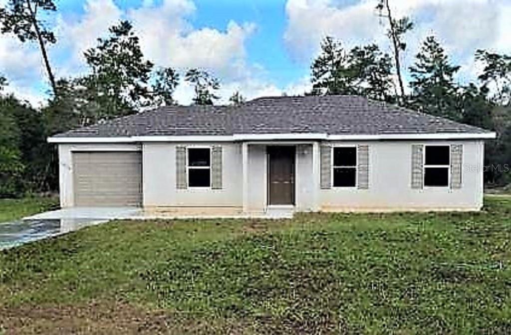 2297 Southwest 146th Loop Ocala, FL 34473 - Photo 1 of 1 a house that has a lot of windows in it