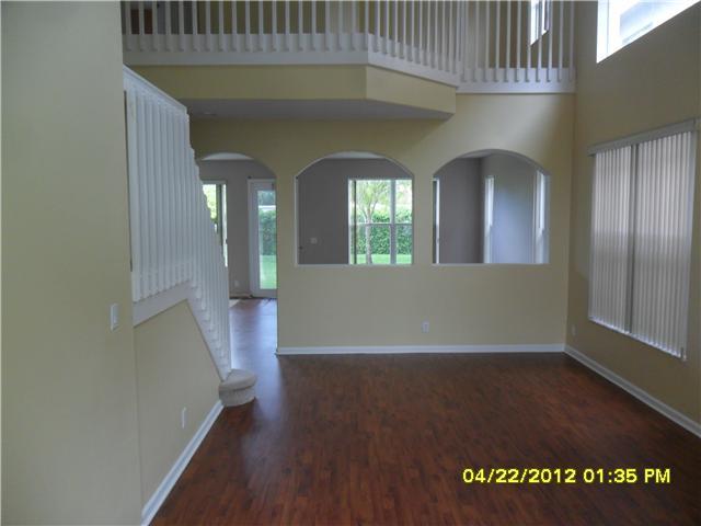 1093 Center Stone Lane Riviera Beach, FL 33404 - Photo 3 of 4 an entryway with a livingroom