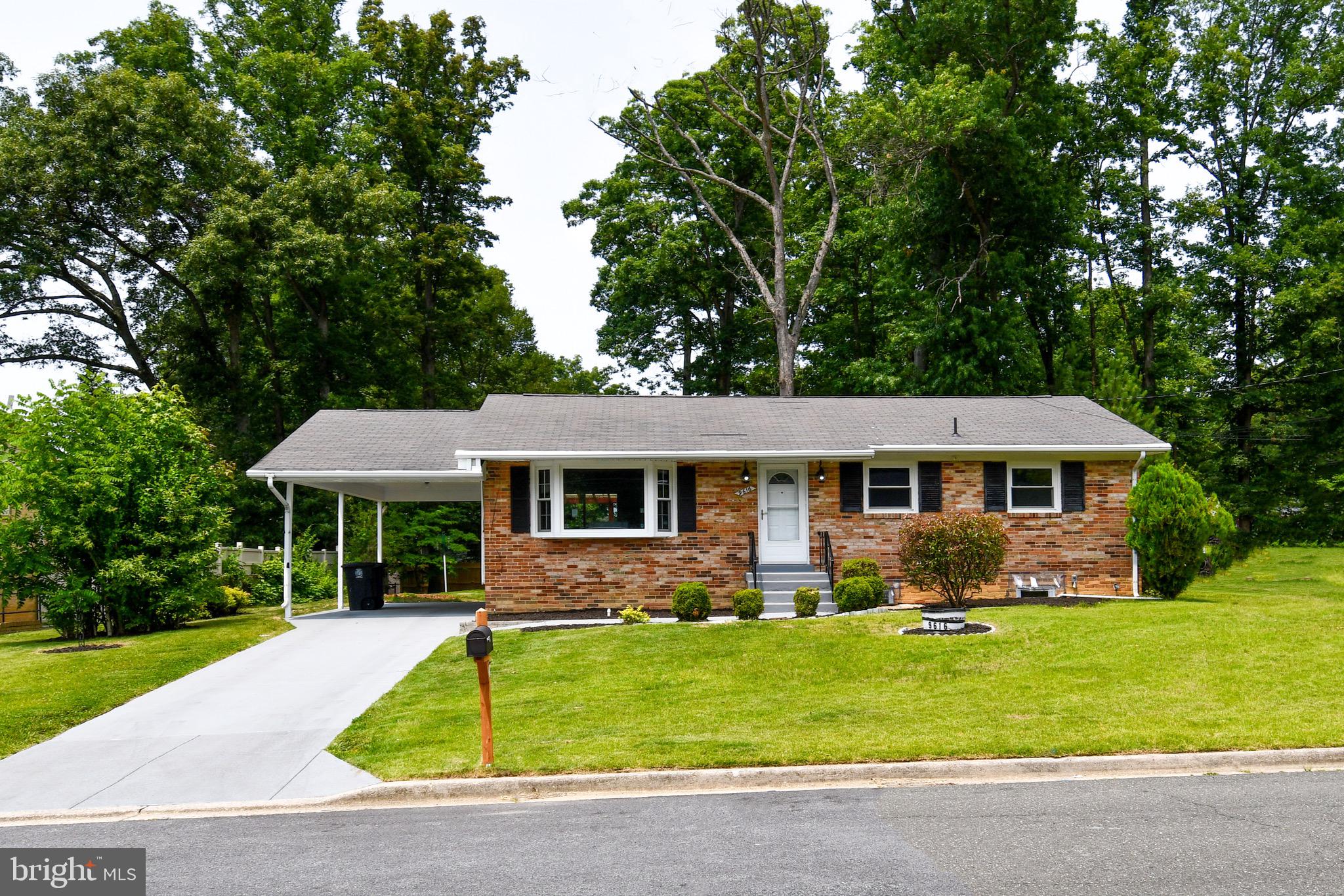 9616 Small Drive Clinton, MD 20735 - Photo 1 of 50 a front view of a house with a yard