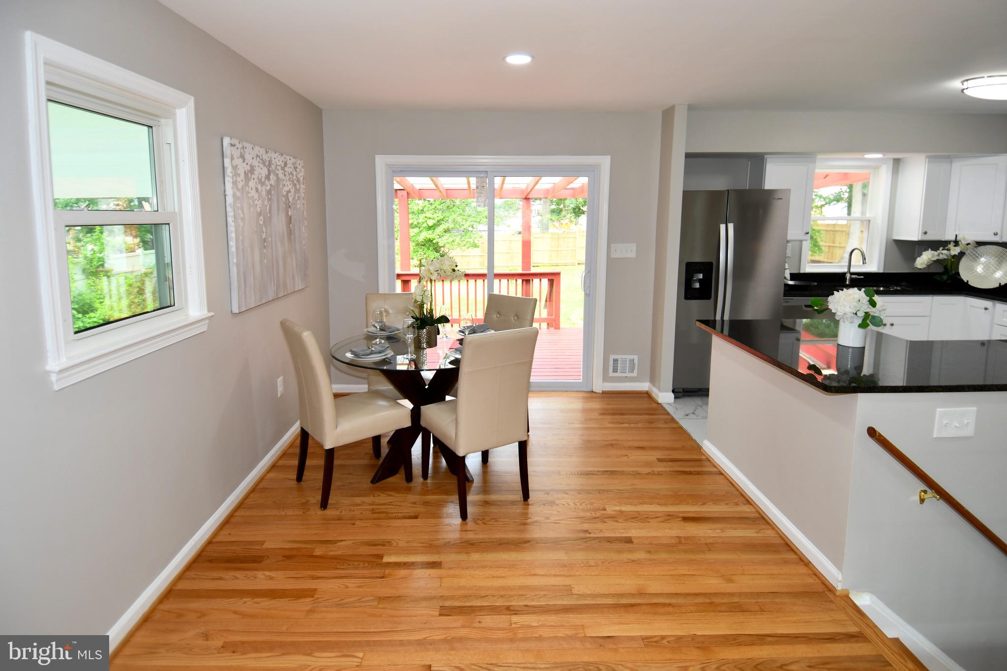 9616 Small Drive Clinton, MD 20735 - Photo 11 of 50 a view of a dining room with furniture and wooden floor