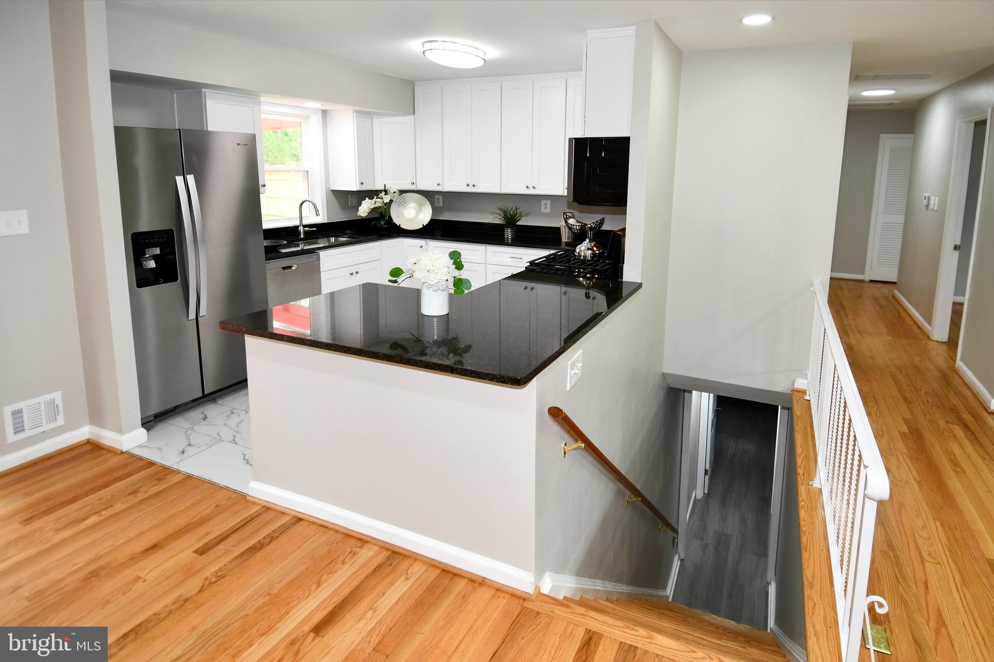 9616 Small Drive Clinton, MD 20735 - Photo 12 of 50 a kitchen with stainless steel appliances a refrigerator sink and microwave