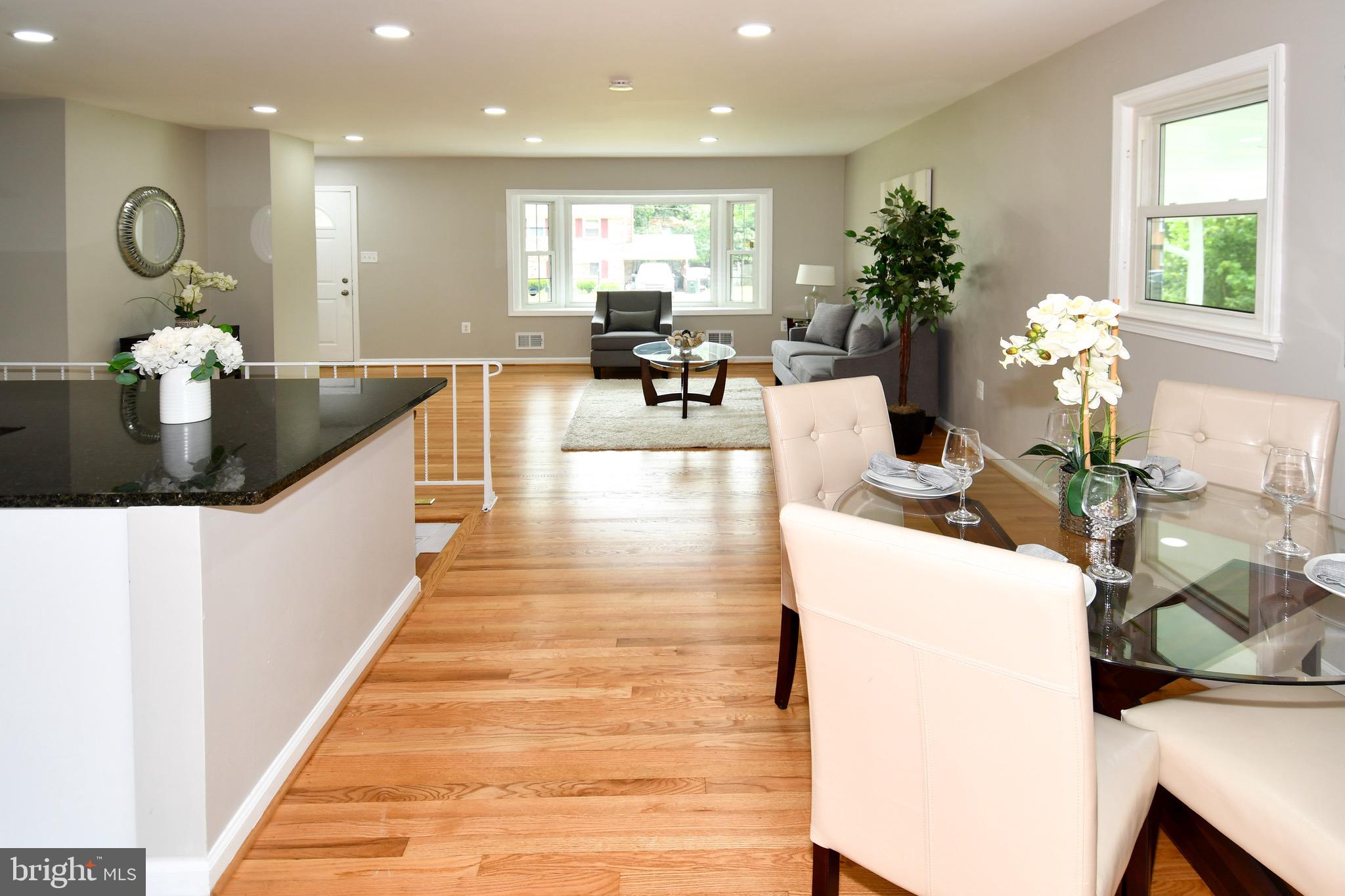 9616 Small Drive Clinton, MD 20735 - Photo 17 of 50 a living room with furniture potted plant and a chandelier