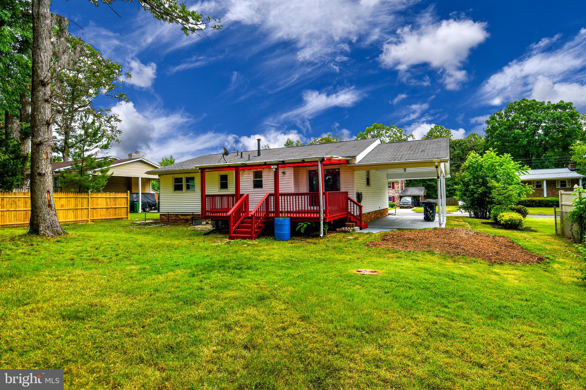 9616 Small Drive Clinton, MD 20735 - Photo 22 of 50 a view of a yard with table and chairs and a big yard