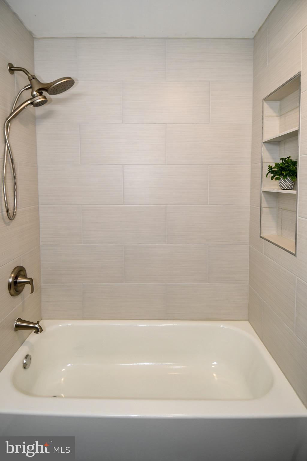 9616 Small Drive Clinton, MD 20735 - Photo 28 of 50 a bathroom with a bathtub