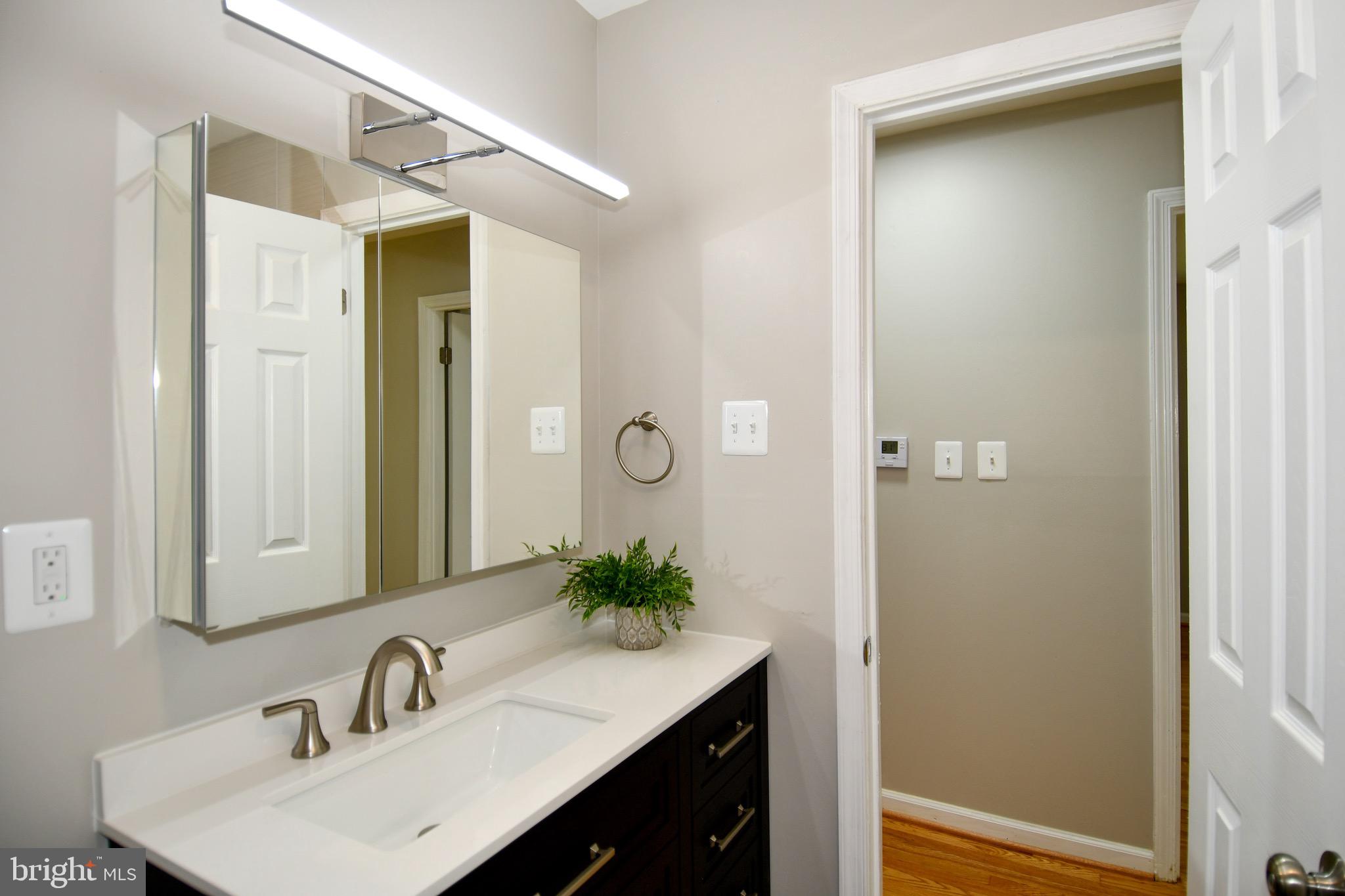 9616 Small Drive Clinton, MD 20735 - Photo 29 of 50 a bathroom with a sink and a mirror