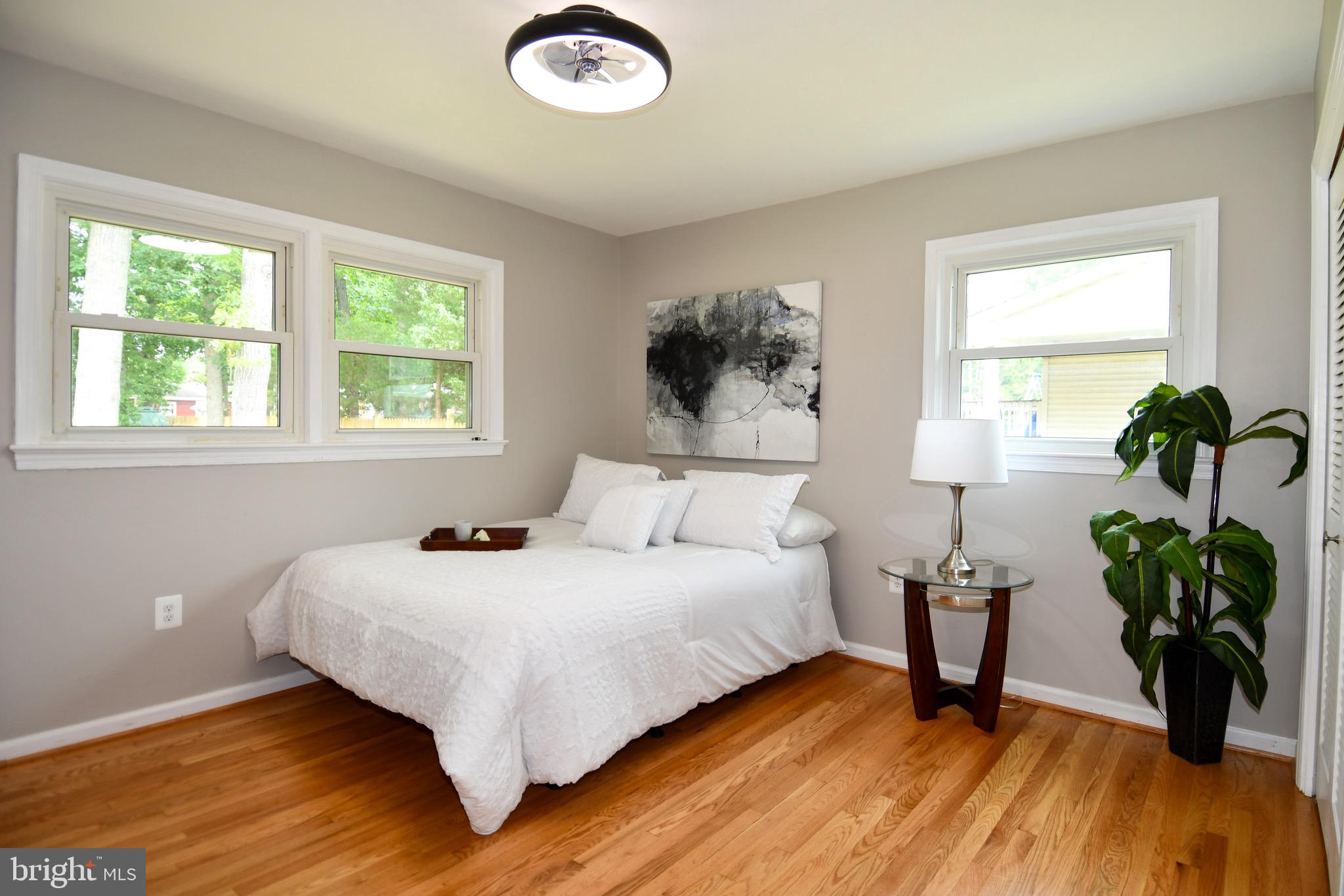 9616 Small Drive Clinton, MD 20735 - Photo 33 of 50 a bedroom with a bed and a potted plant