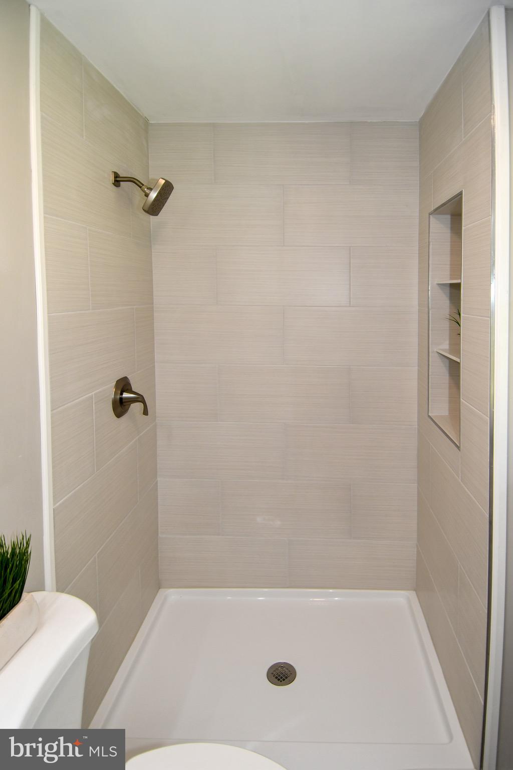 9616 Small Drive Clinton, MD 20735 - Photo 36 of 50 a bathroom with a tub and toilet