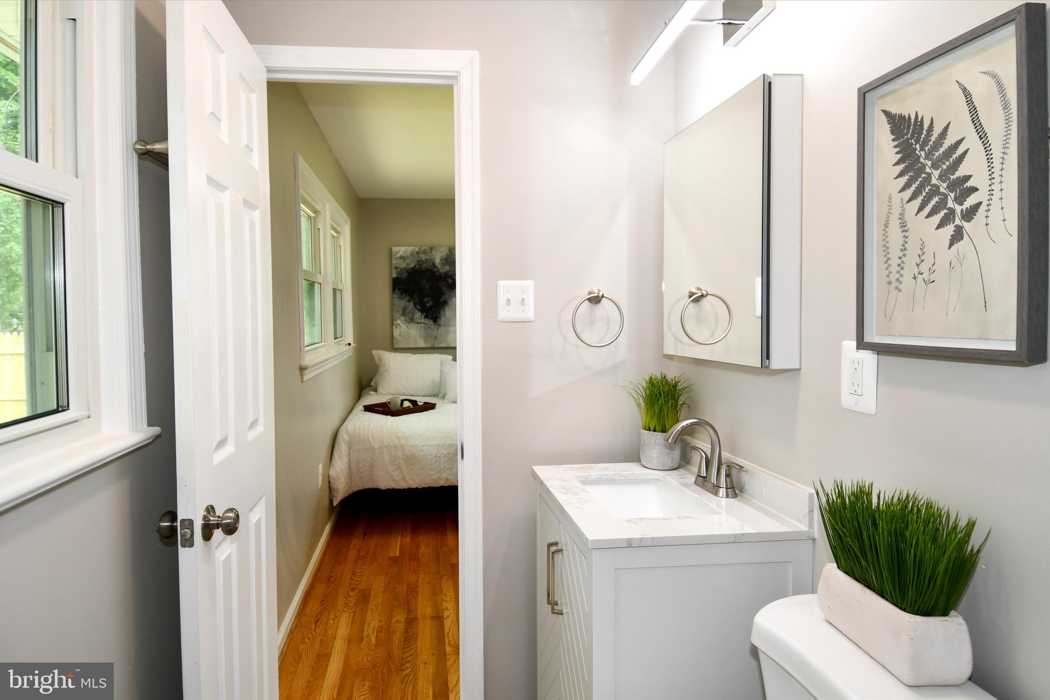 9616 Small Drive Clinton, MD 20735 - Photo 37 of 50 a bedroom with a bed and a couch