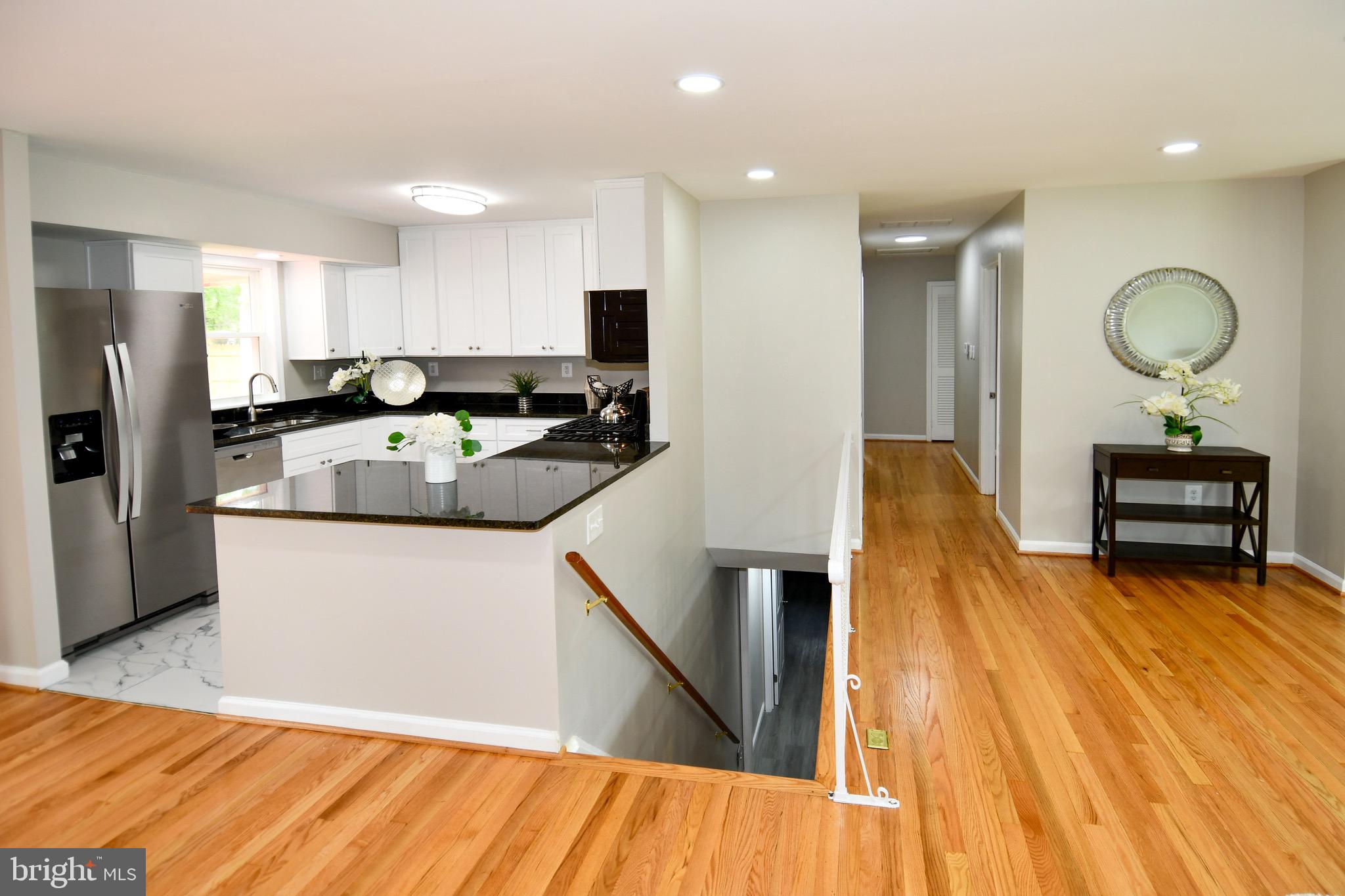 9616 Small Drive Clinton, MD 20735 - Photo 38 of 50 a kitchen with sink refrigerator and microwave