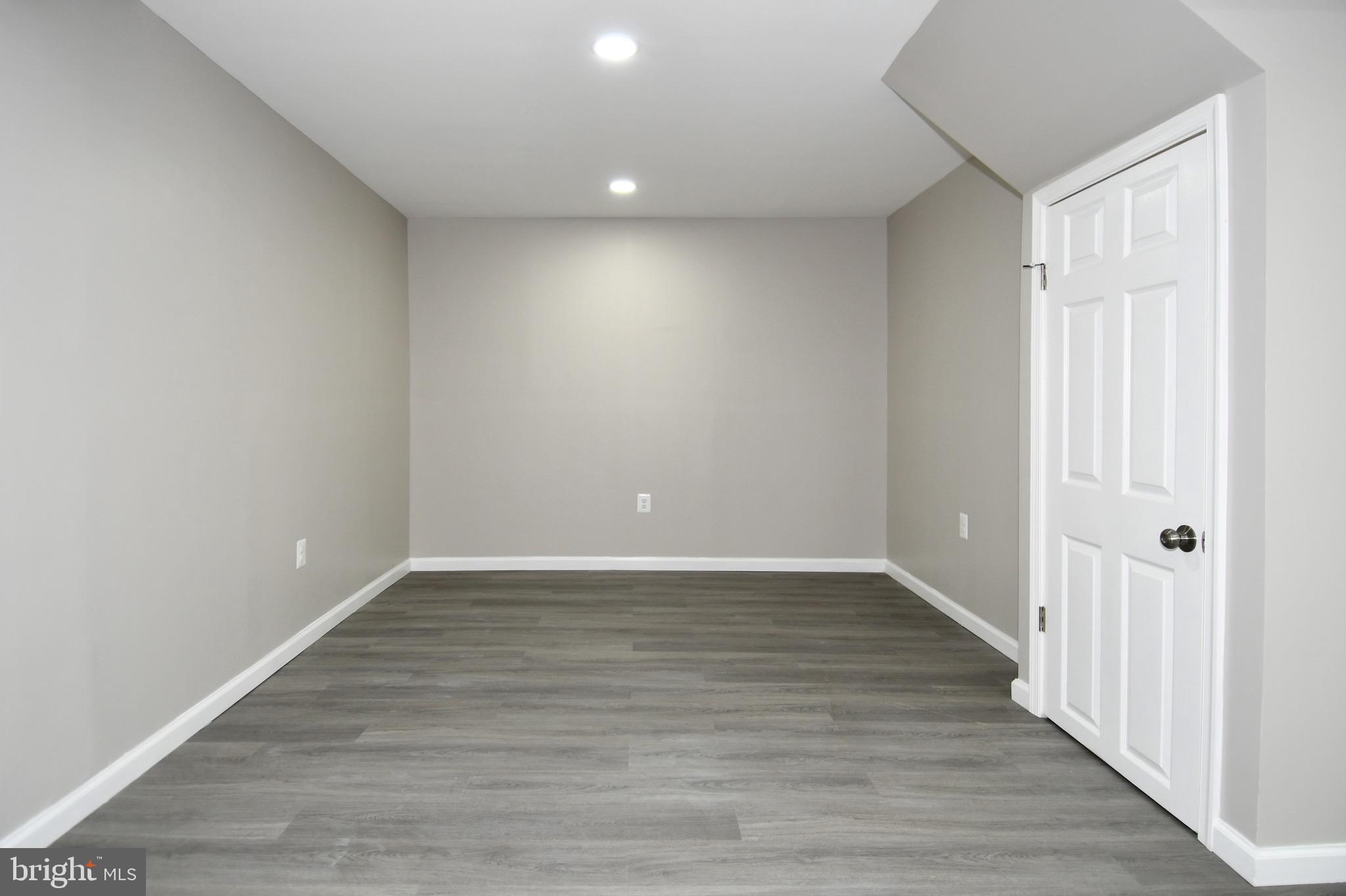 9616 Small Drive Clinton, MD 20735 - Photo 46 of 50 a view of an empty room with wooden floor