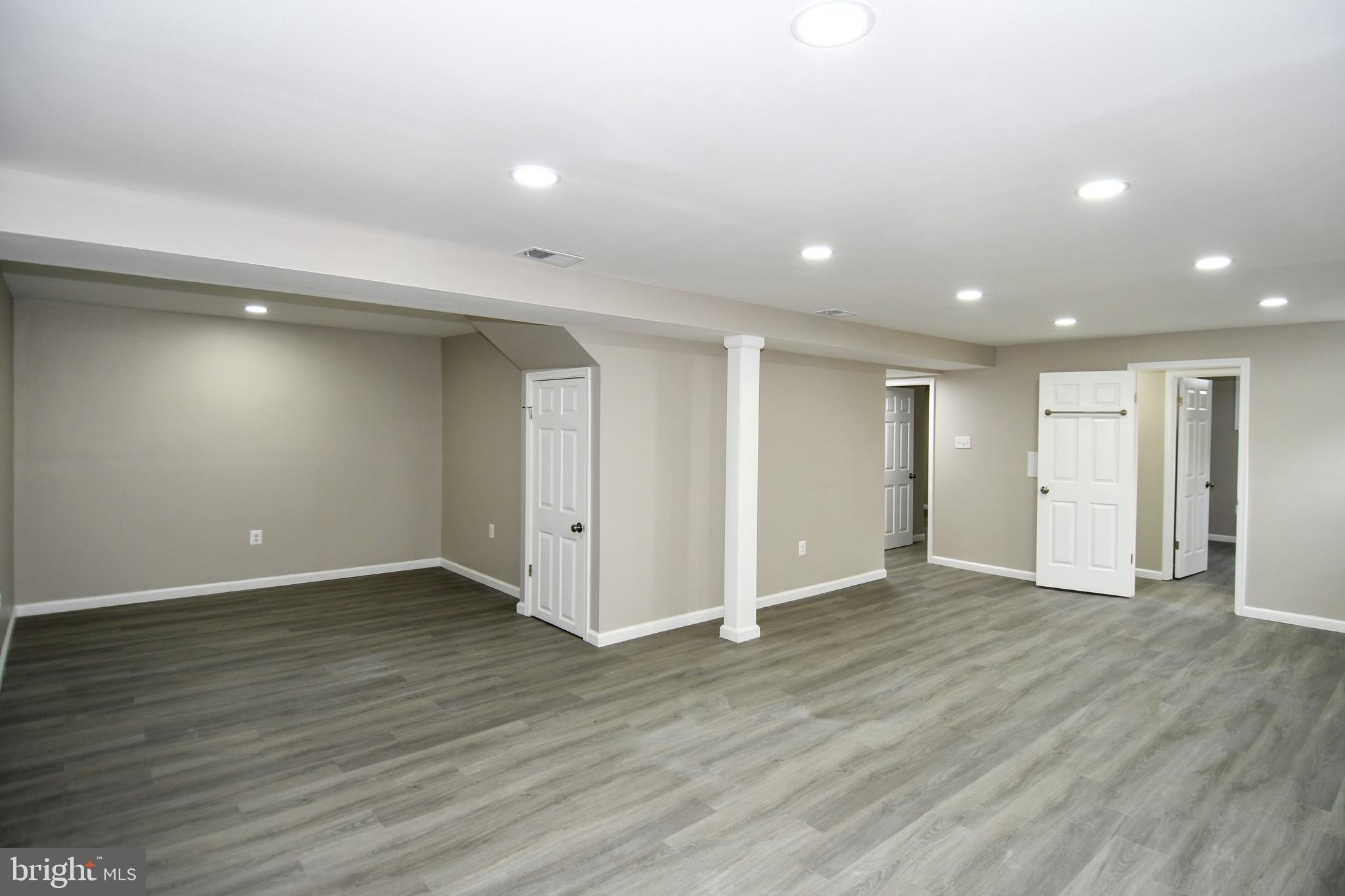 9616 Small Drive Clinton, MD 20735 - Photo 47 of 50 a view of an empty room with wooden floor