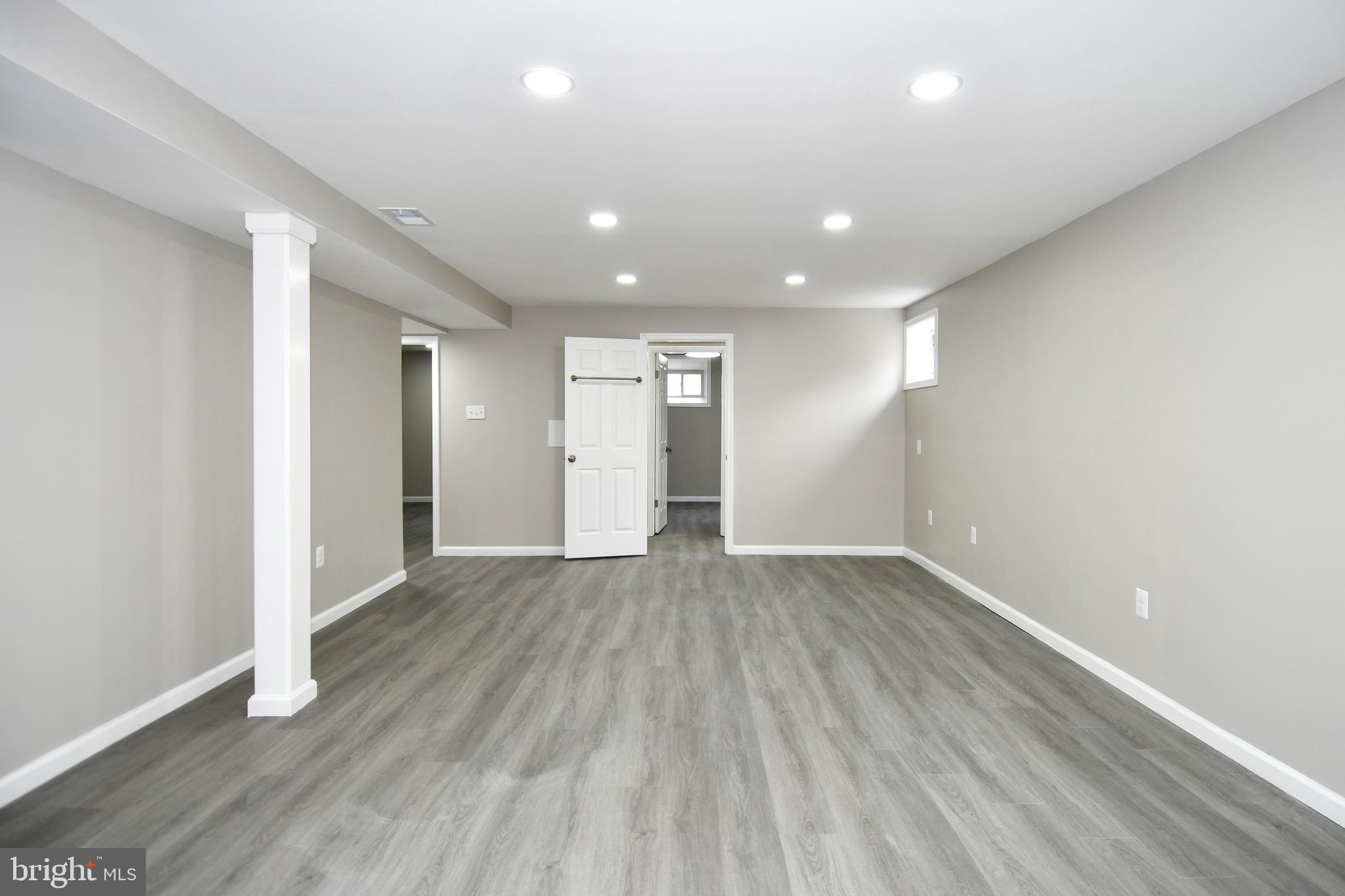 9616 Small Drive Clinton, MD 20735 - Photo 48 of 50 a view of an empty room with wooden floor