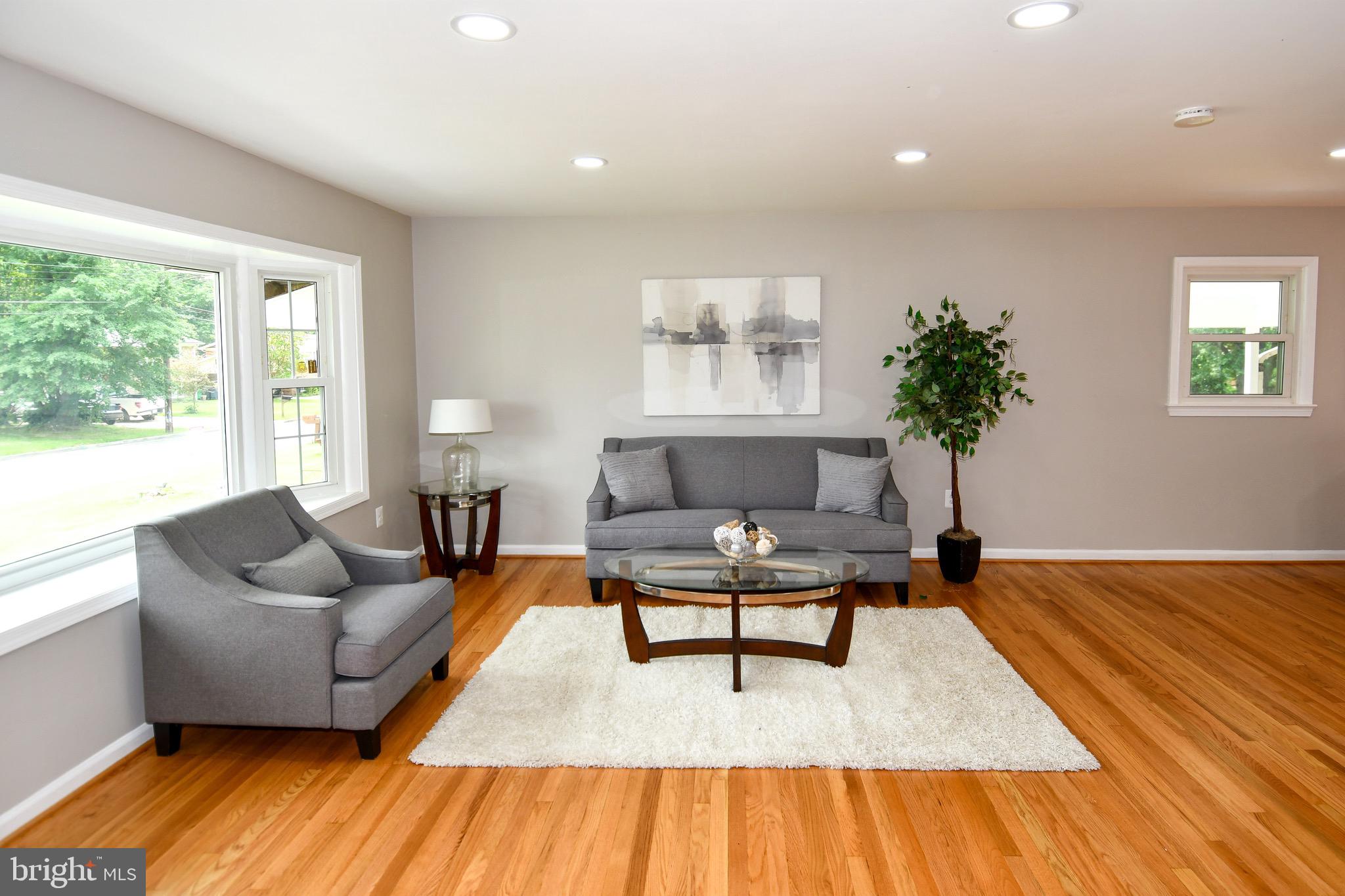 9616 Small Drive Clinton, MD 20735 - Photo 7 of 50 a living room with furniture and a wooden floor