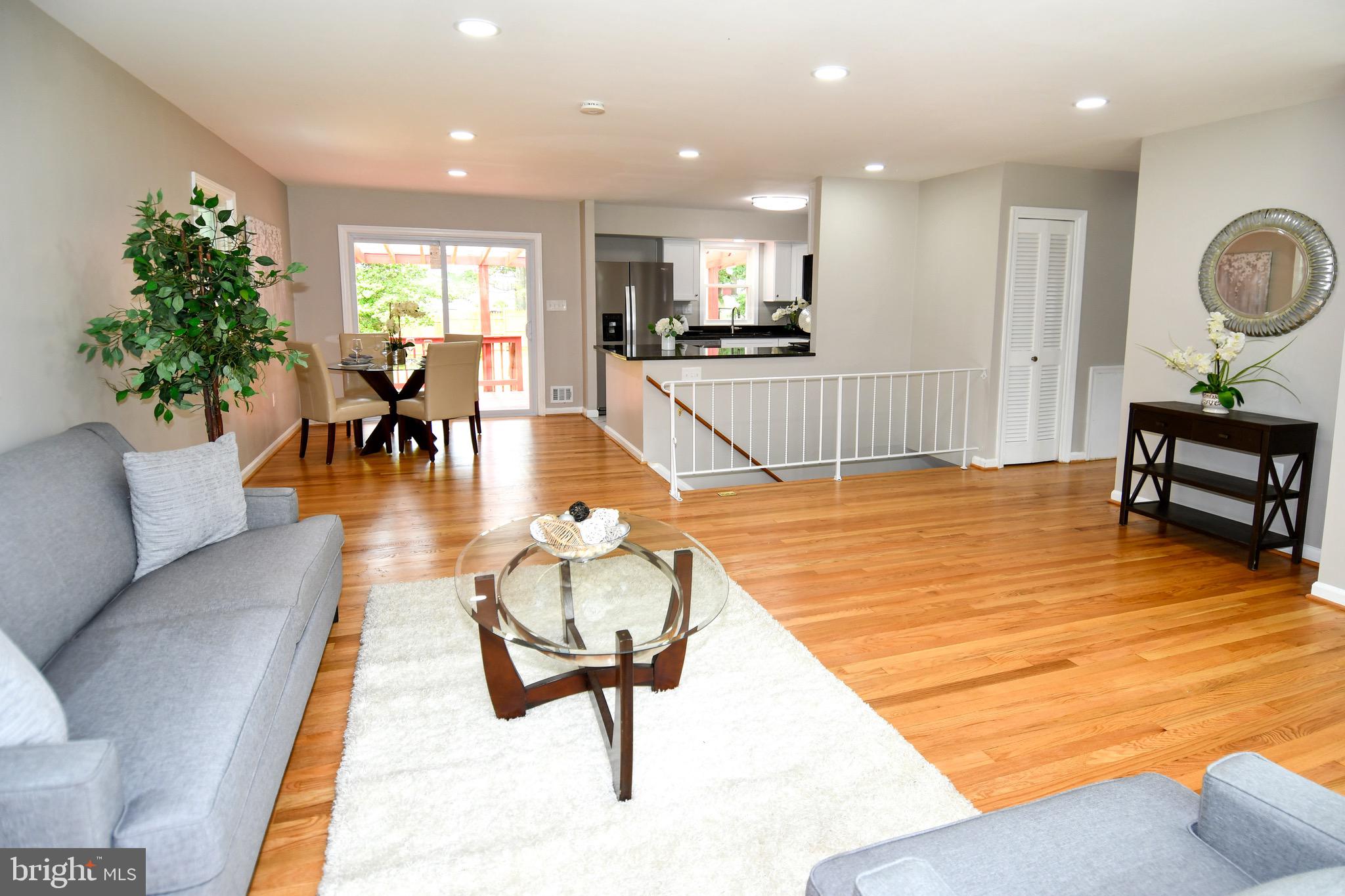 9616 Small Drive Clinton, MD 20735 - Photo 8 of 50 a living room filled with furniture and a table
