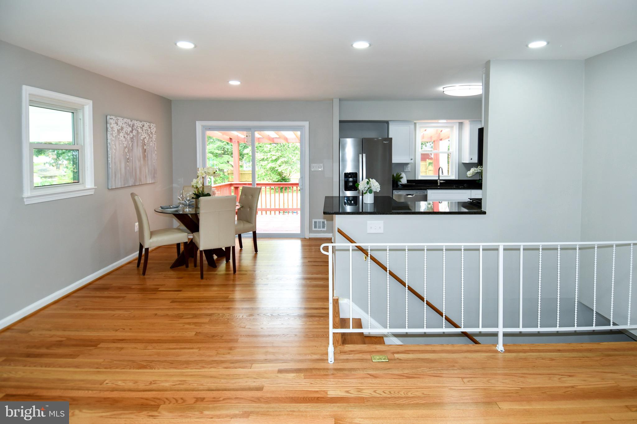 9616 Small Drive Clinton, MD 20735 - Photo 9 of 50 a view of kitchen and dining room with wooden floor