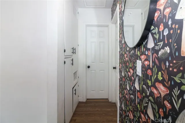 a view of an entryway with wooden floor