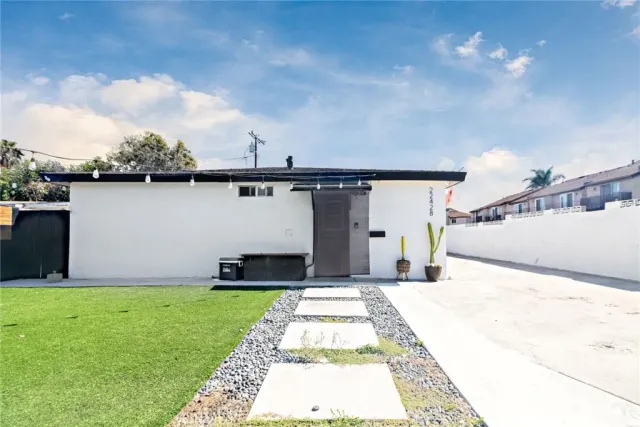 a view of a backyard with potted plants