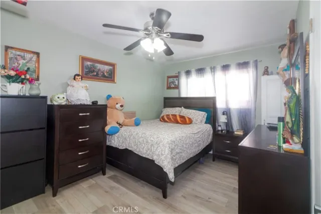 a bedroom with a bed and a dresser