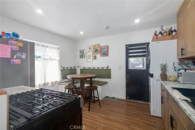 a kitchen with a table and chairs in it