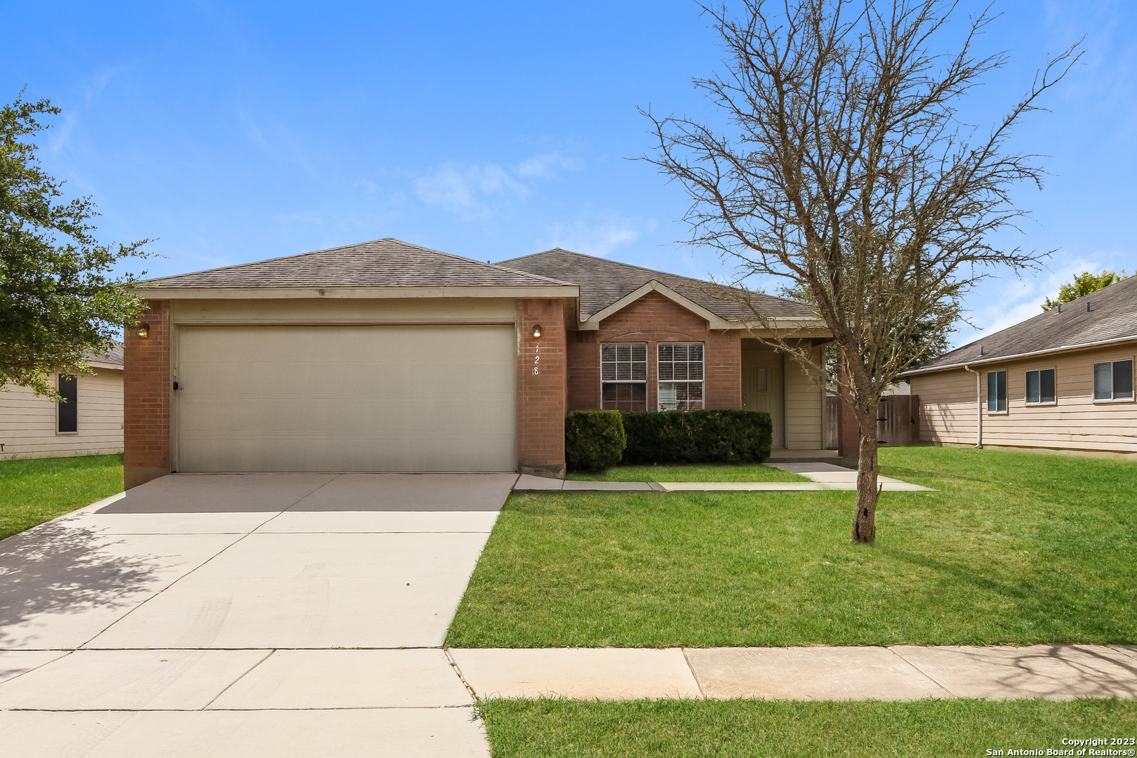 a front view of a house with a yard