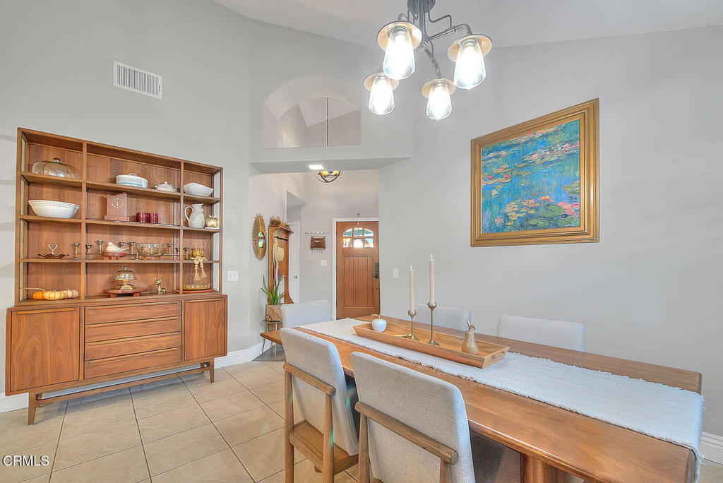 420 West 3rd Street San Dimas, CA 91773 - Photo 16 of 19 a view of a dining room with furniture and chandelier