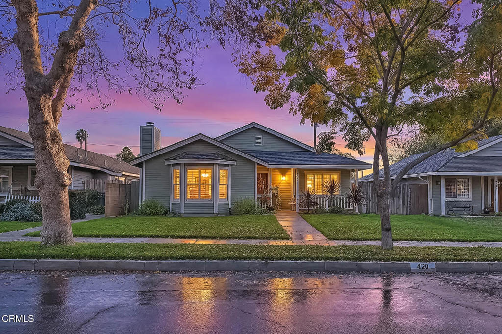 420 West 3rd Street San Dimas, CA 91773 - Photo 2 of 19 a front view of a house with a yard and garage