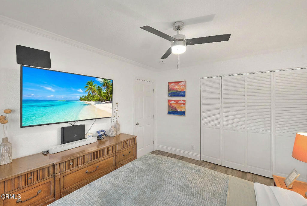 420 West 3rd Street San Dimas, CA 91773 - Photo 8 of 19 a bathroom with a double vanity sink a mirror and shower