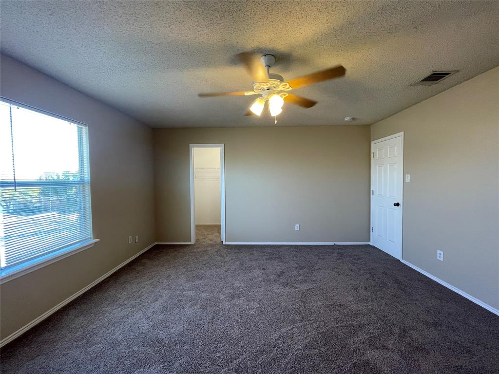 4855 Diamond Trace Trail Fort Worth, TX 76244 - Photo 14 of 21 an empty room with a window and a ceiling fan