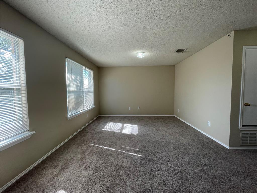 4855 Diamond Trace Trail Fort Worth, TX 76244 - Photo 16 of 21 an empty room with windows