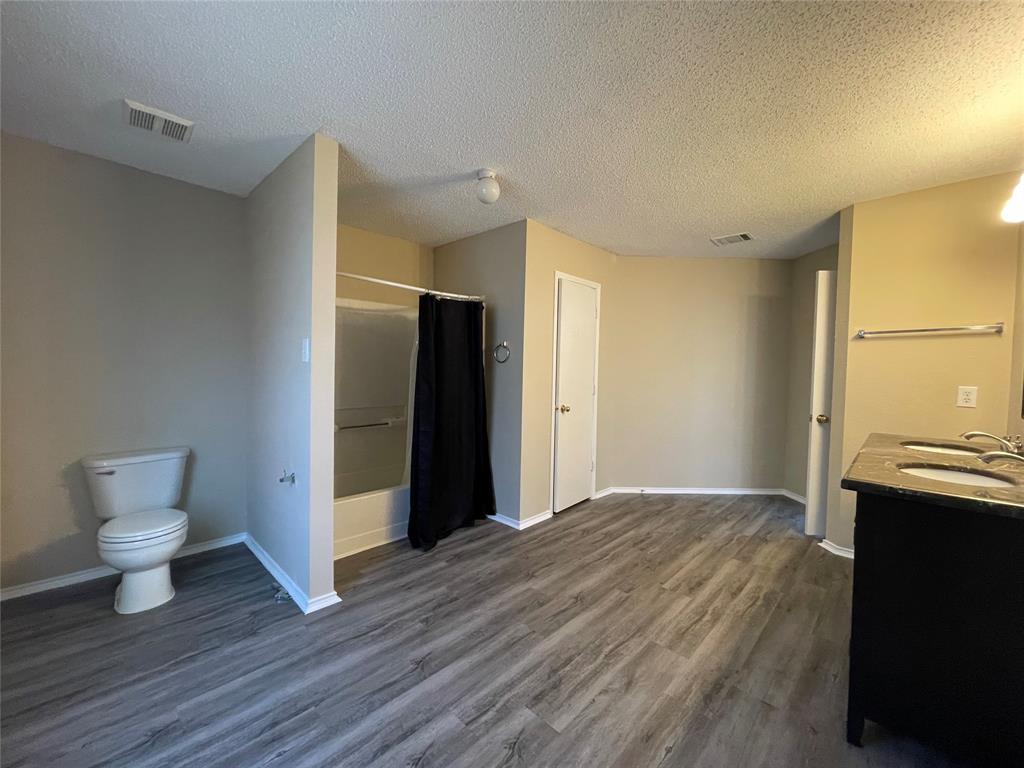 4855 Diamond Trace Trail Fort Worth, TX 76244 - Photo 18 of 21 a view of a kitchen cabinets and a wooden floor
