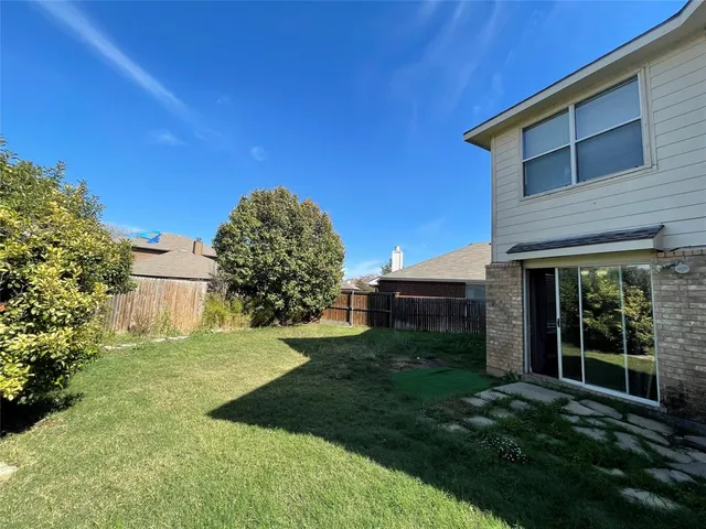 a view of a livingroom with a ceiling fan and window