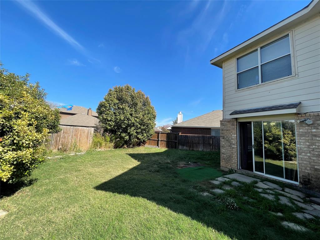 4855 Diamond Trace Trail Fort Worth, TX 76244 - Photo 20 of 21 a view of a backyard with plants and large trees