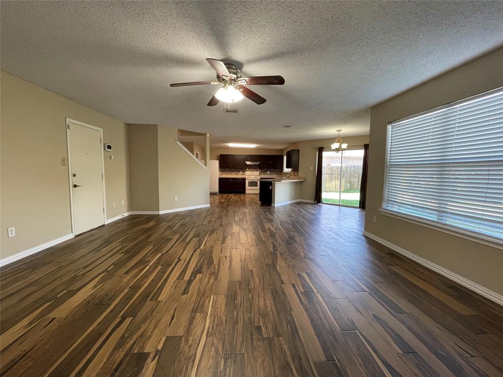 4855 Diamond Trace Trail Fort Worth, TX 76244 - Photo 4 of 21 a view of empty room with wooden floor and fan