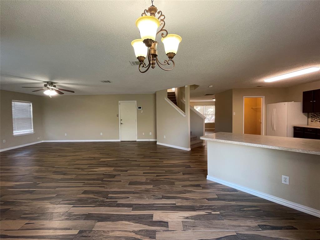 4855 Diamond Trace Trail Fort Worth, TX 76244 - Photo 21 of 21 a view of a room with wooden floor and staircase
