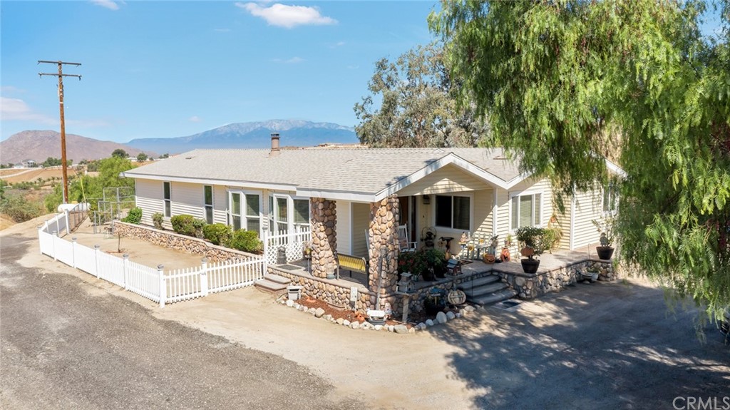24460 Woodson Road Colton, CA 92324 - Photo 1 of 1 a view of a house with a outdoor space