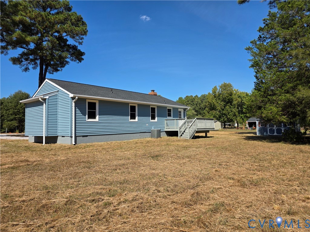 7613 Squirrel Level Road Petersburg, VA 23805 - Photo 7 of 30 Blue siding exterior with white trim windows and a