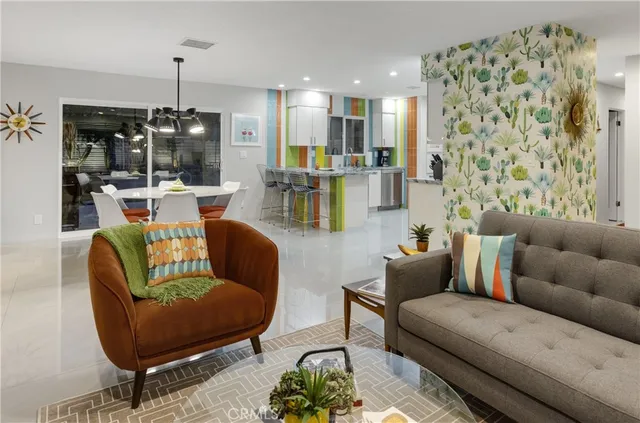 a living room with furniture and a mirror