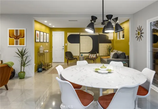 a large kitchen with a table and chairs