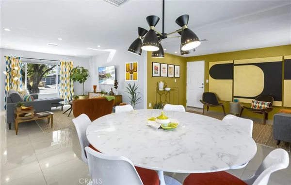 a kitchen with stainless steel appliances granite countertop a sink and a refrigerator